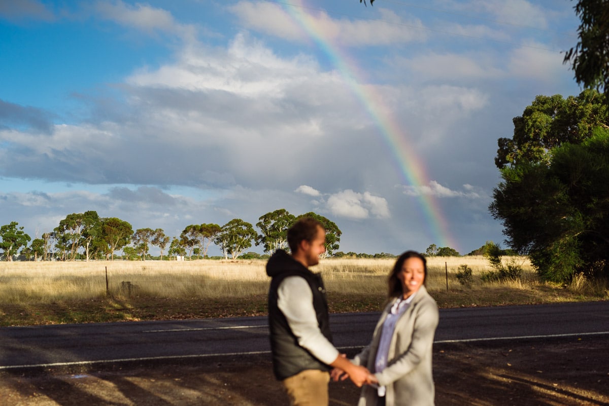 Couple in love with a rainbow background