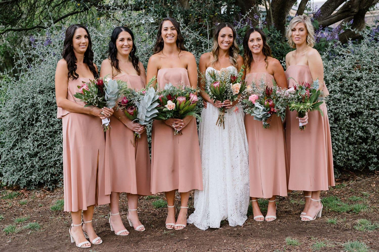 Bride and bridesmaids in pink dresses