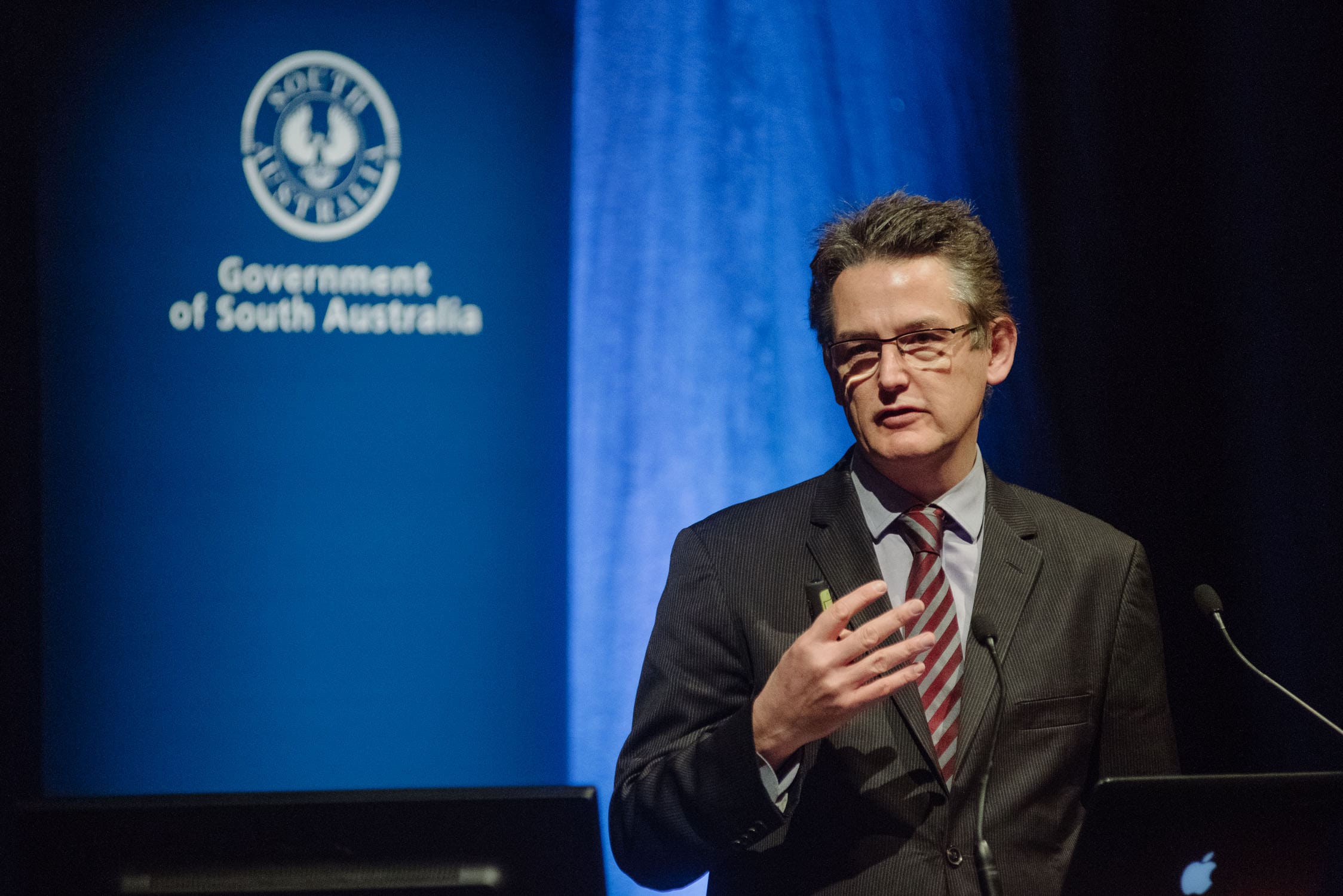 John Dee presents at a conference in Adelaide