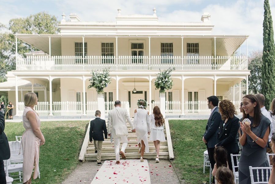 Couple walking towards Como house