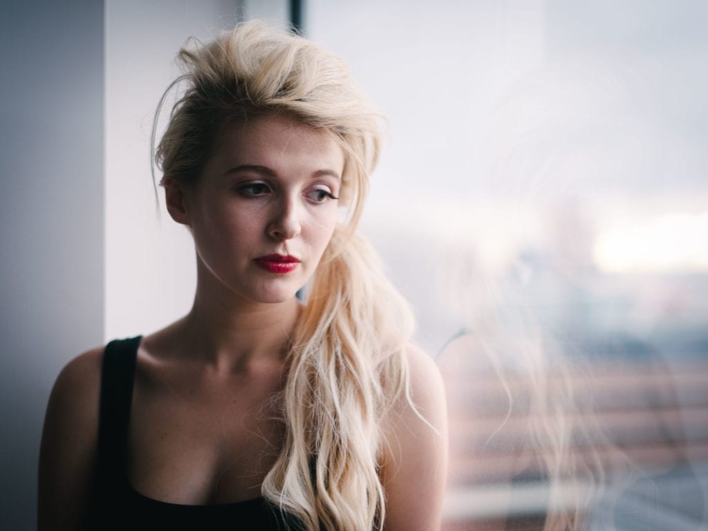 Model stares out of window in Melbourne