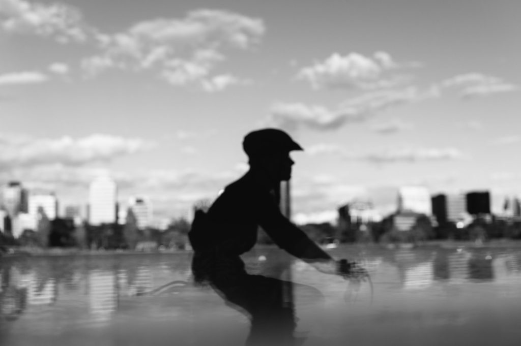 Cyclist in front of the Melbourne skyline