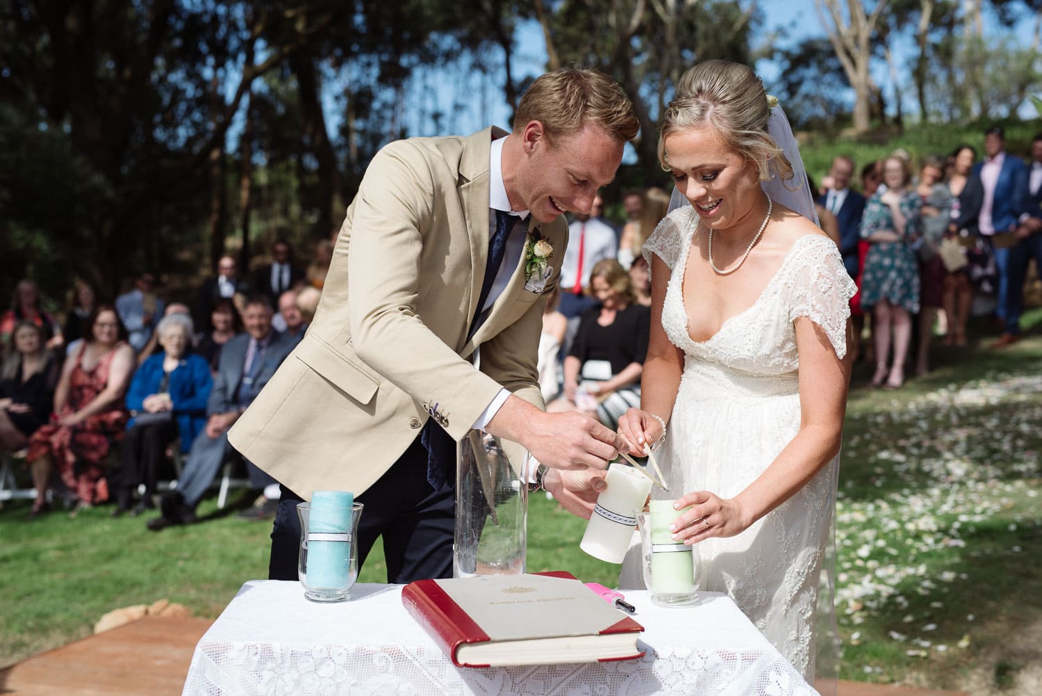 Bride and Groom lighting wedding candles