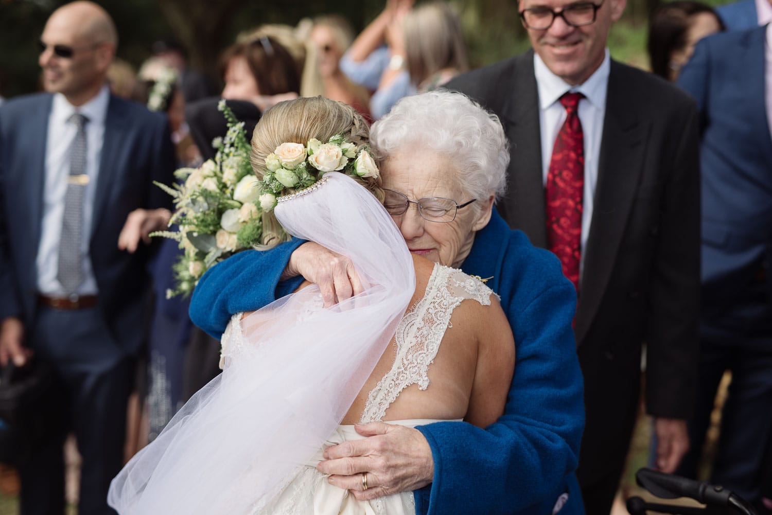 Bride hugging her emotional grandmother