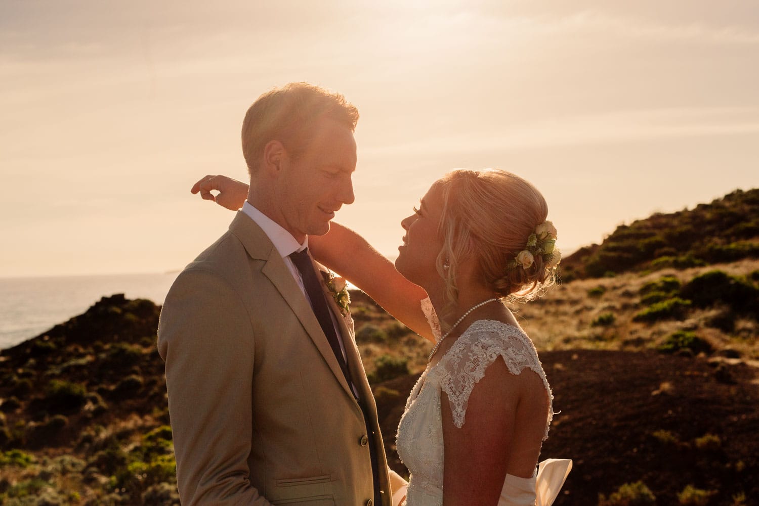 Golden light portrait of a bride and groom on the great ocean road