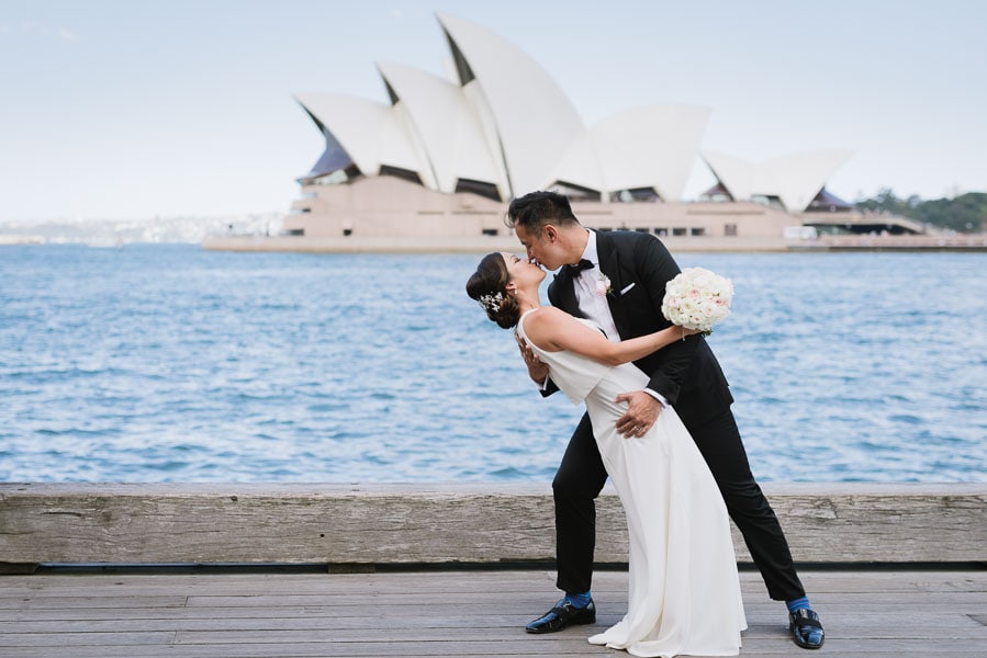 Bride and Groom kissing with the Sydney Opera House