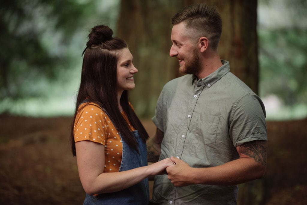 Happy couple in the Redwood plantation near the great ocean road