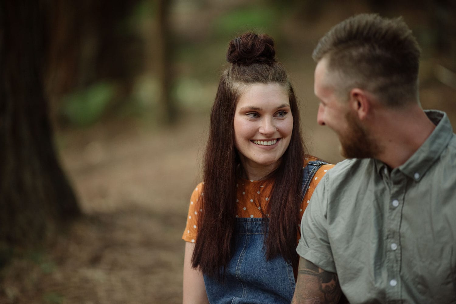 Chelsea smiles at Luke on their engagement session