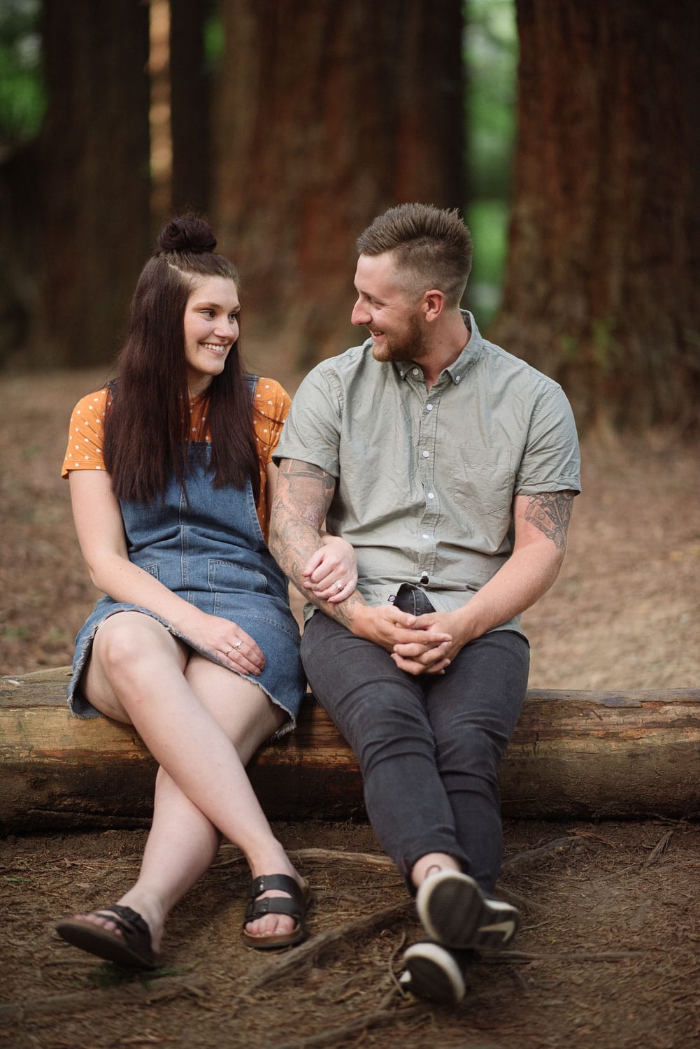 Loved up couple sitting together