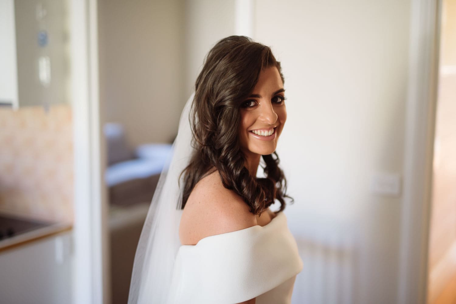 Bride smiling in her dress