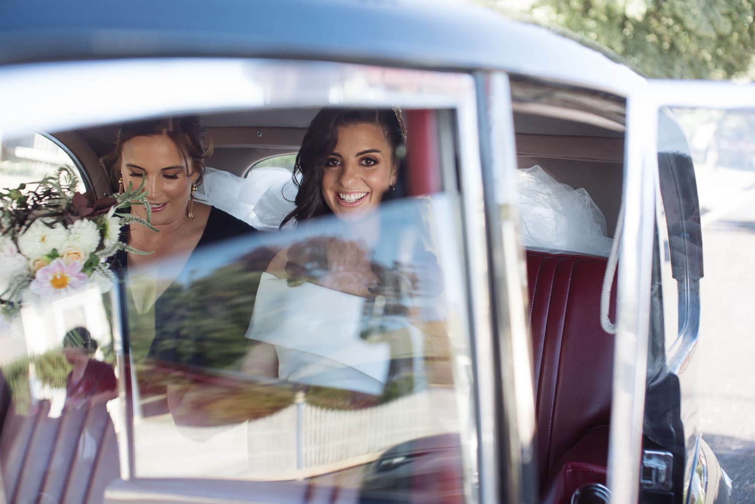 Bride in a classic car near Hamilton