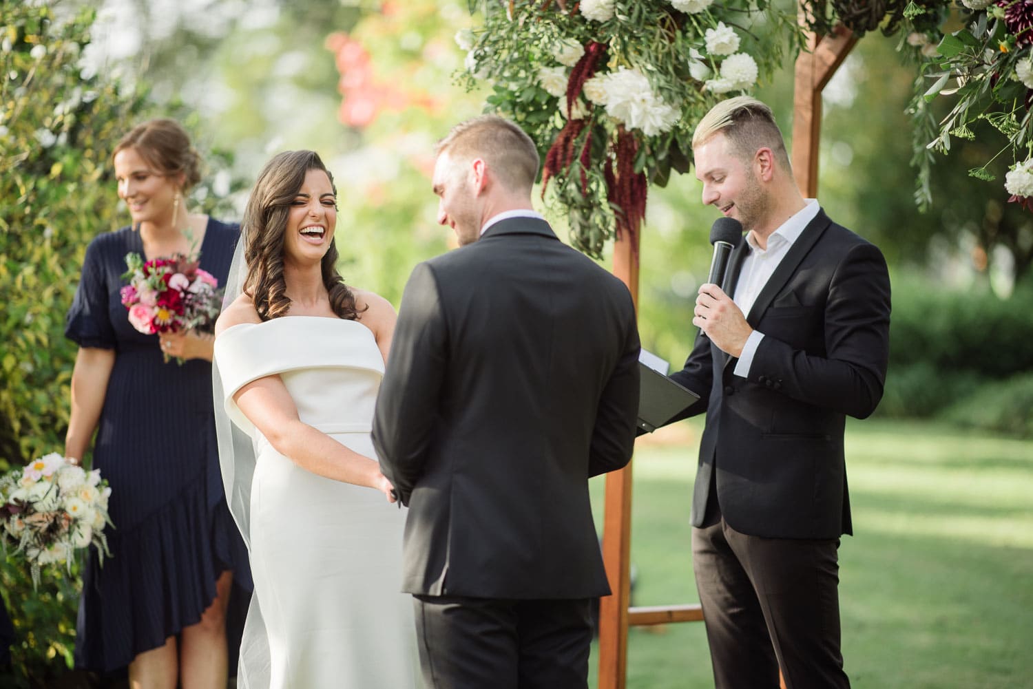 Laughing bride during a backyard wedding