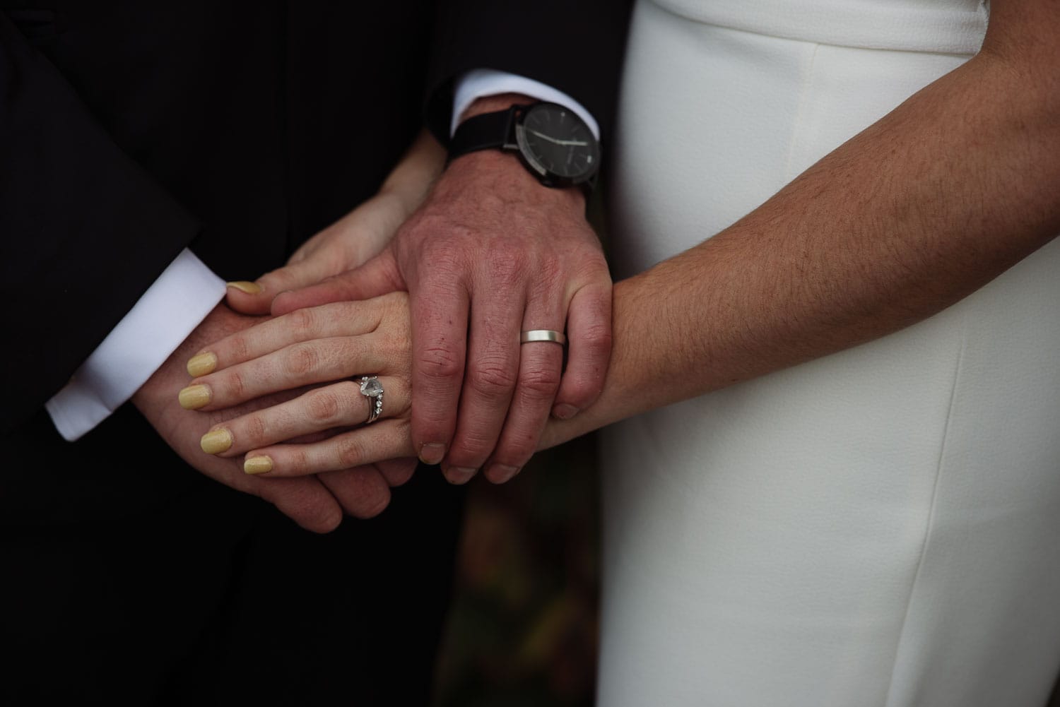 Bride and Groom showing their wedding rings