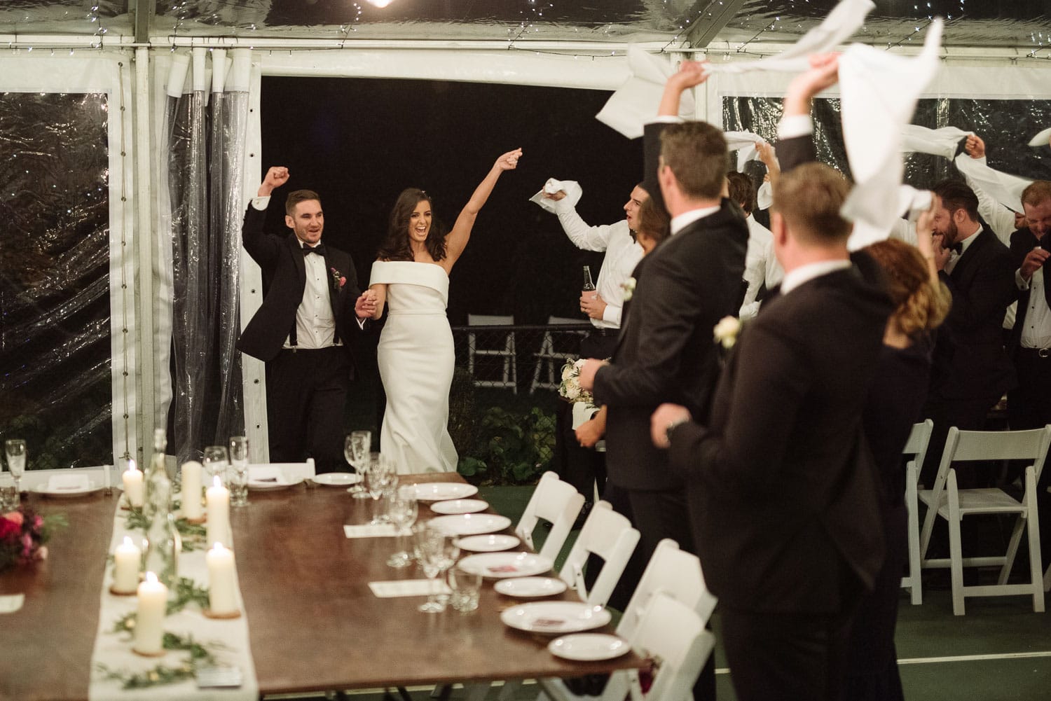 Bride and groom enter their backyard reception