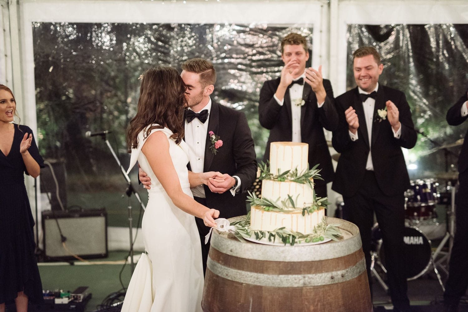 Kissing near the wedding cake