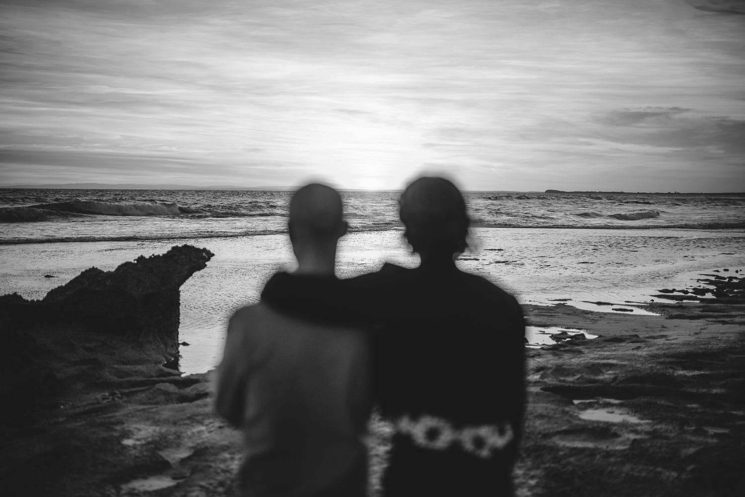 Couple look out over the ocean near Geelong