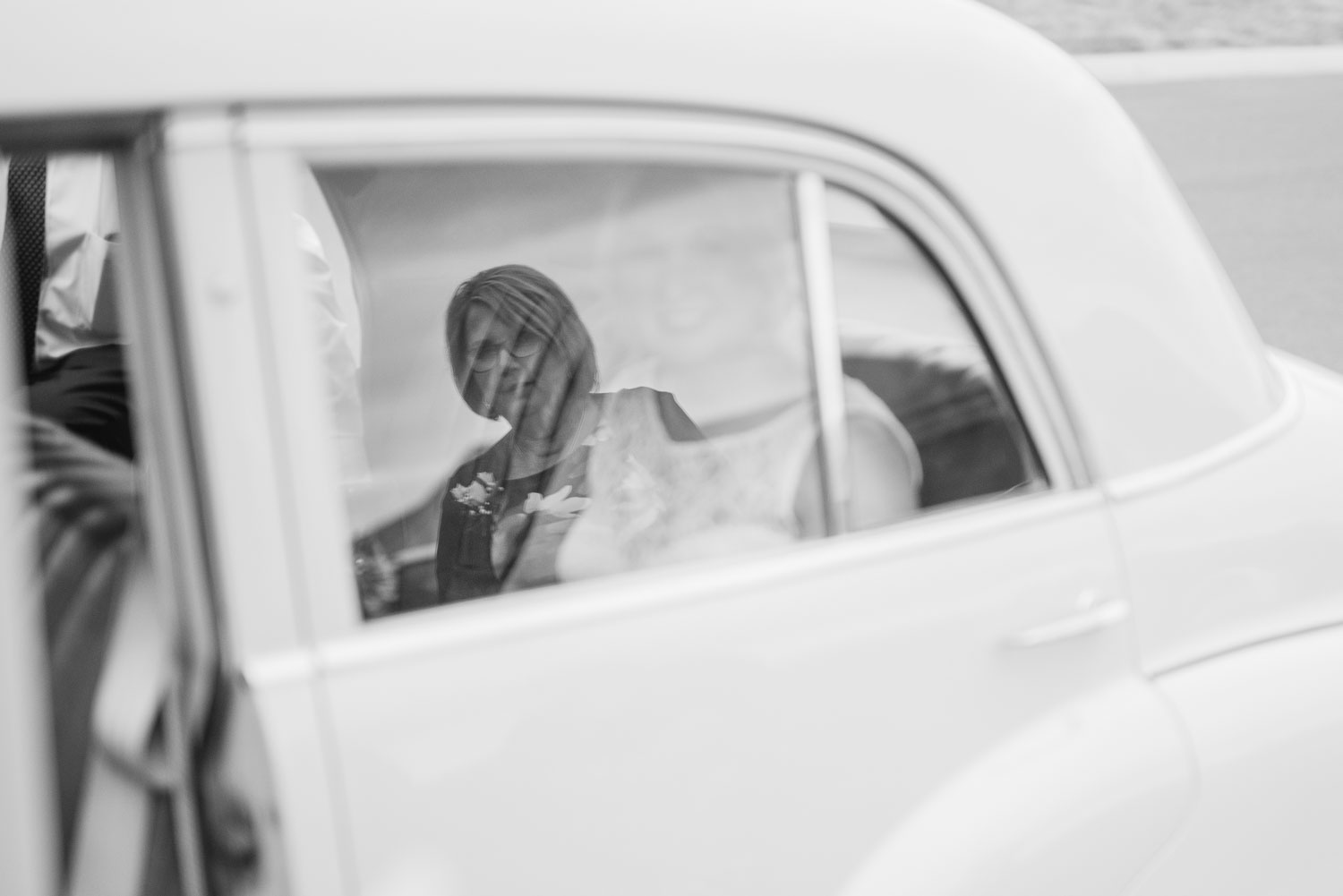 Mother of the bride watches wedding car