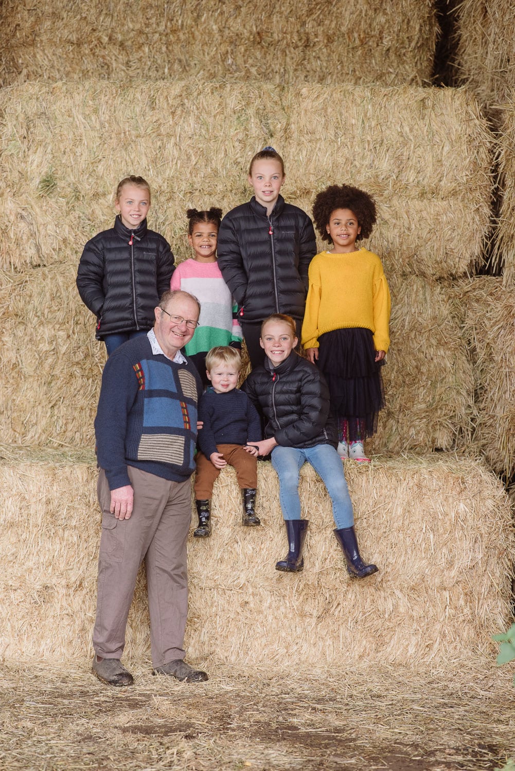 Grandchildren in a hayshed