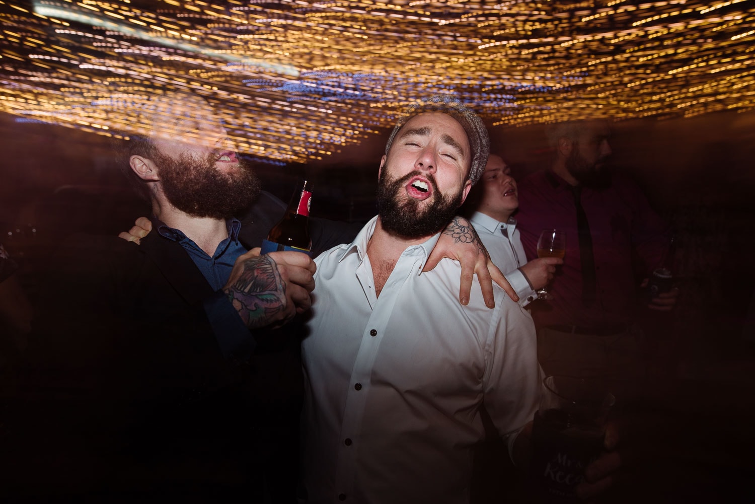 Groom having fun on the dancefloor at his wedding