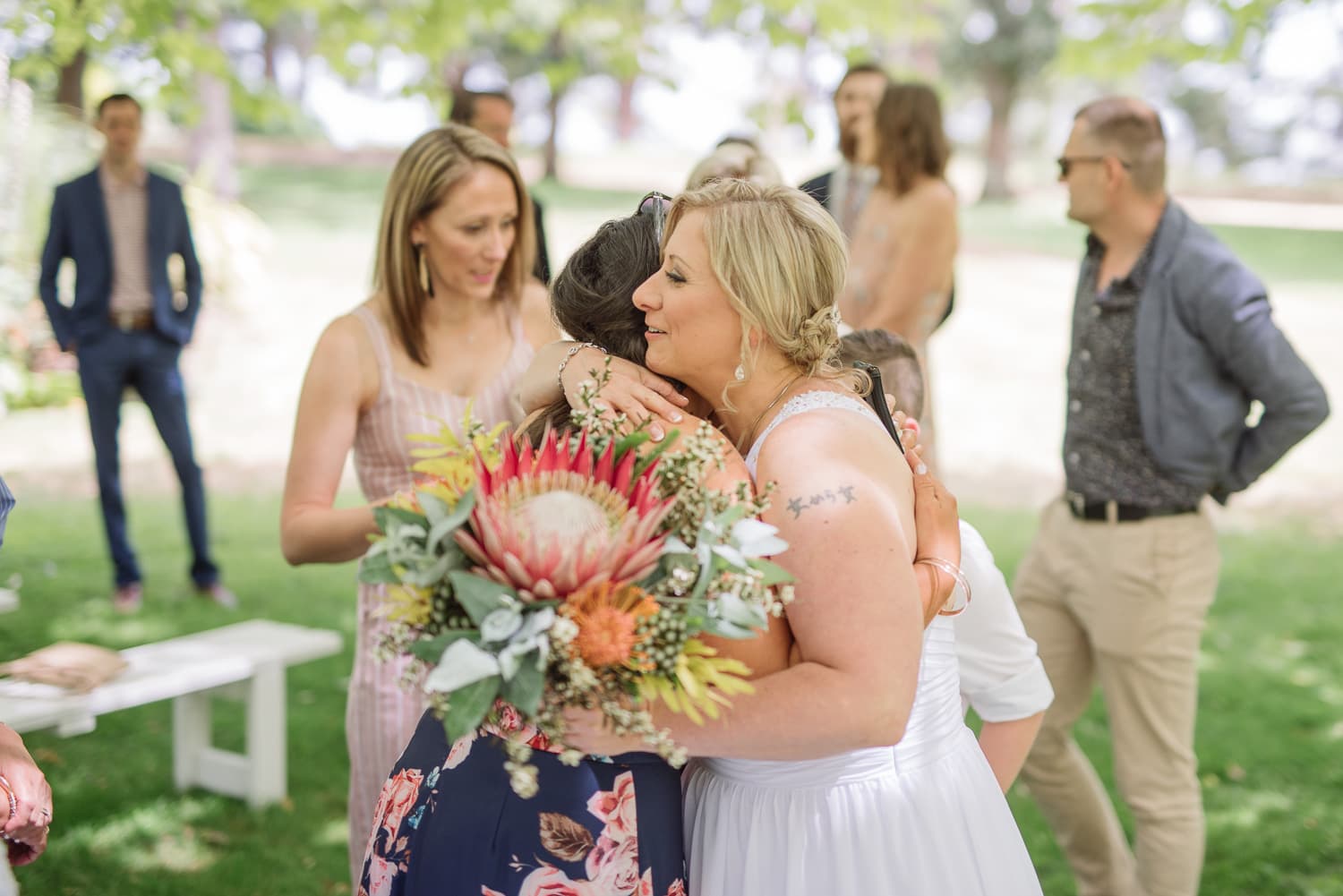 bride hugs guests at a colac wedding