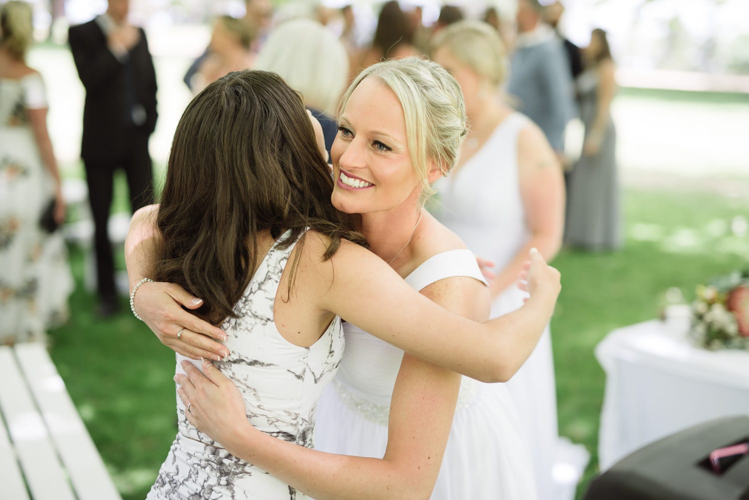 Bride hugging guests at a wedding in colac
