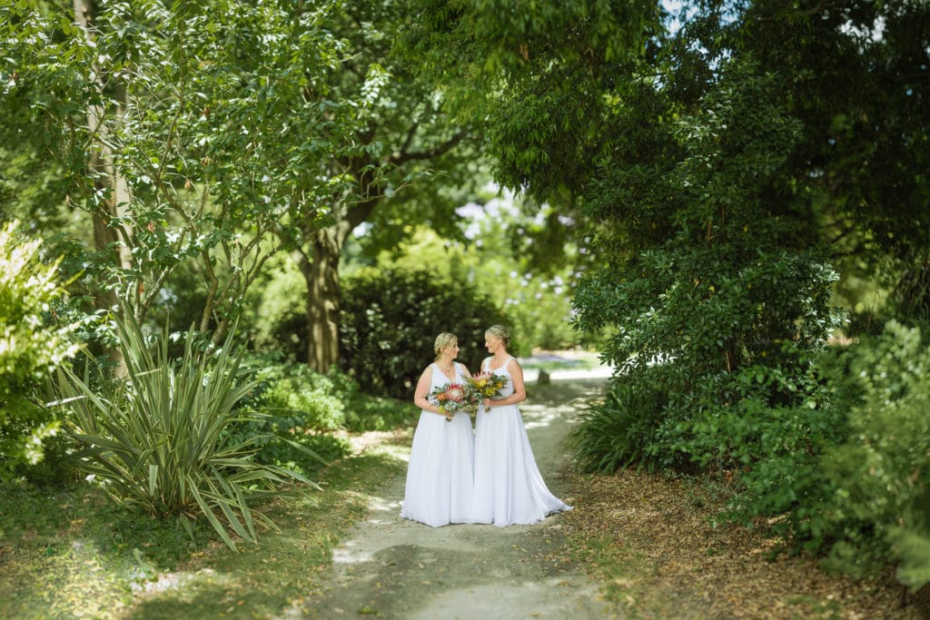 Brides in Colac botanic gardens after a same sex wedding