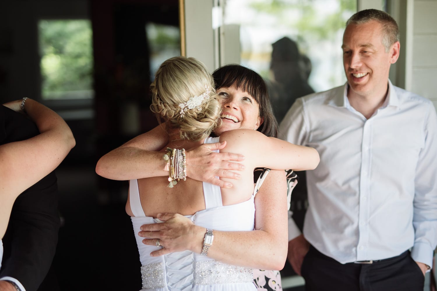 Bride hugs friend at Colac Botanic Cafe