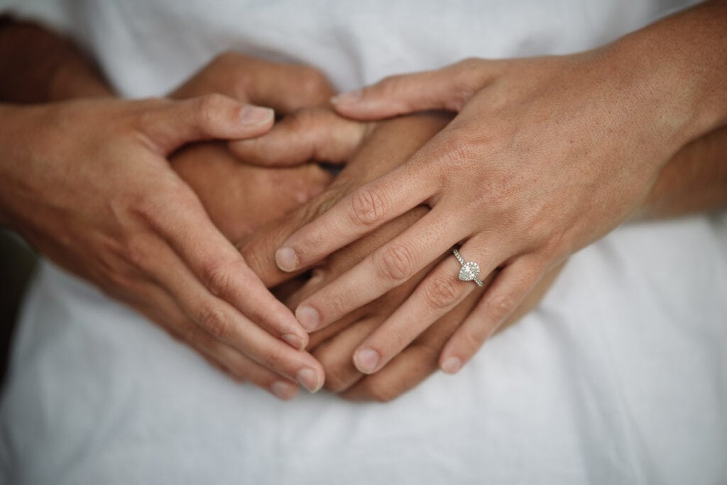 Engaged couple's hands
