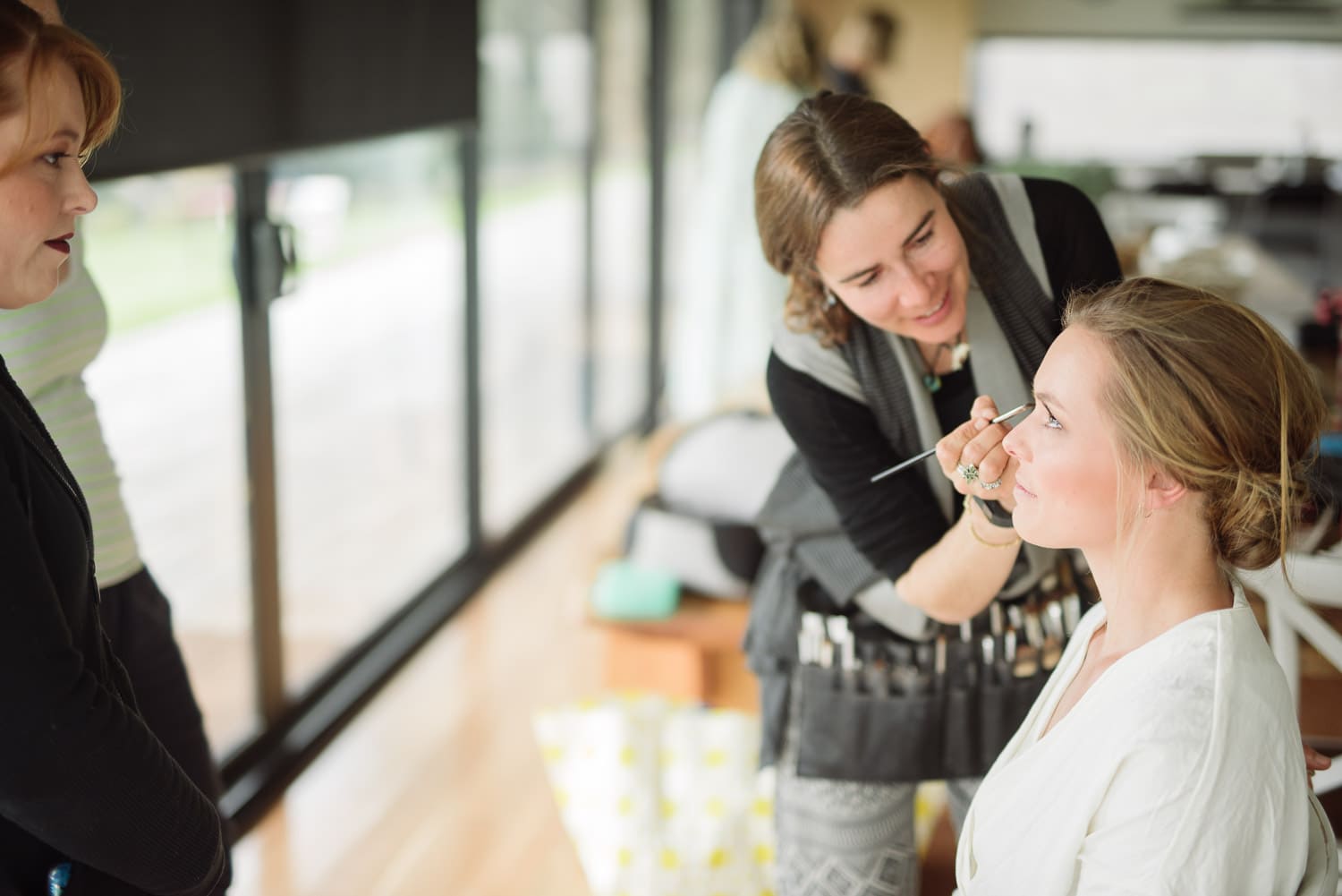 Bride getting makeup done at The Elliot wedding venue