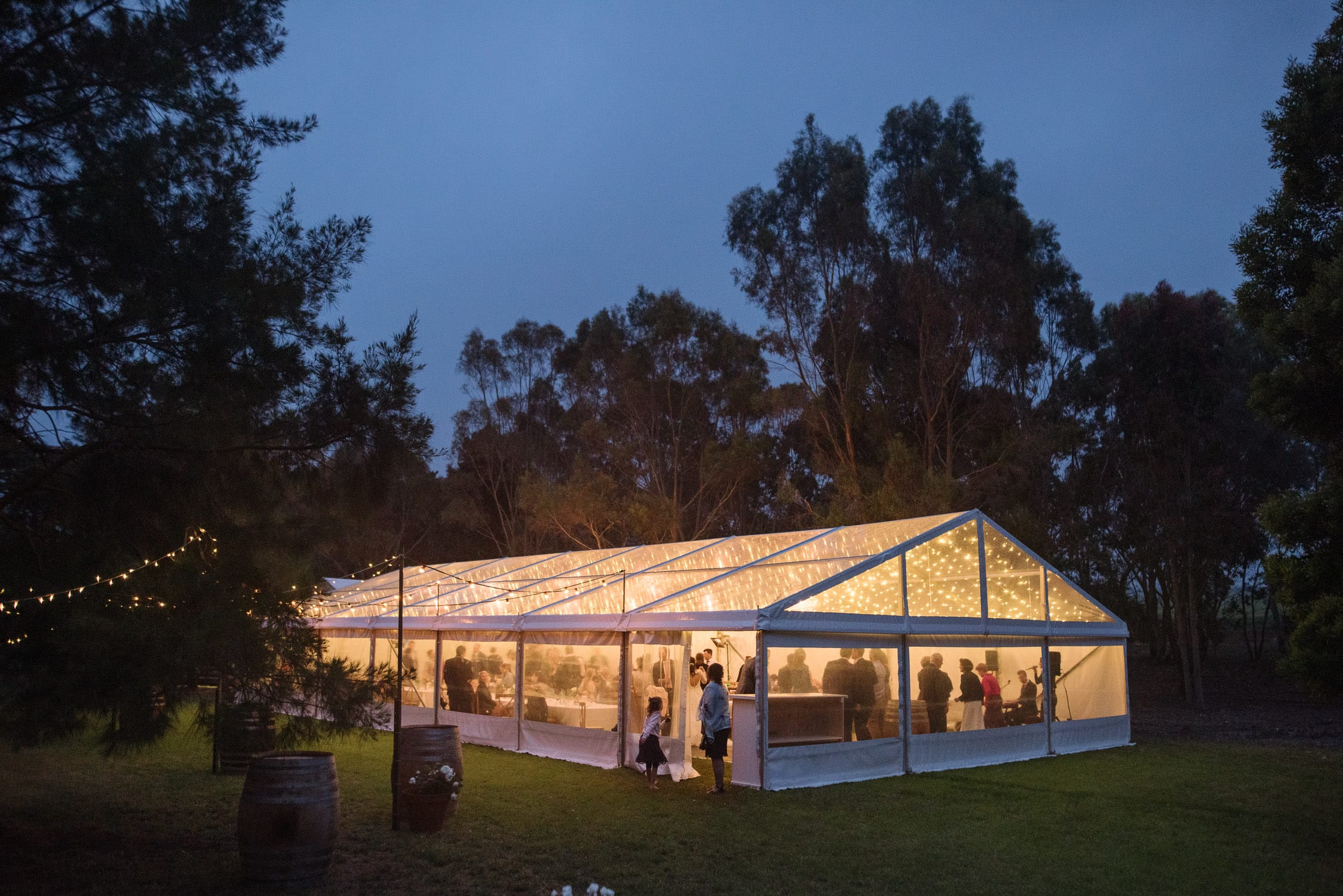Clear marquee lit up at dusk after a wedding in Beeac