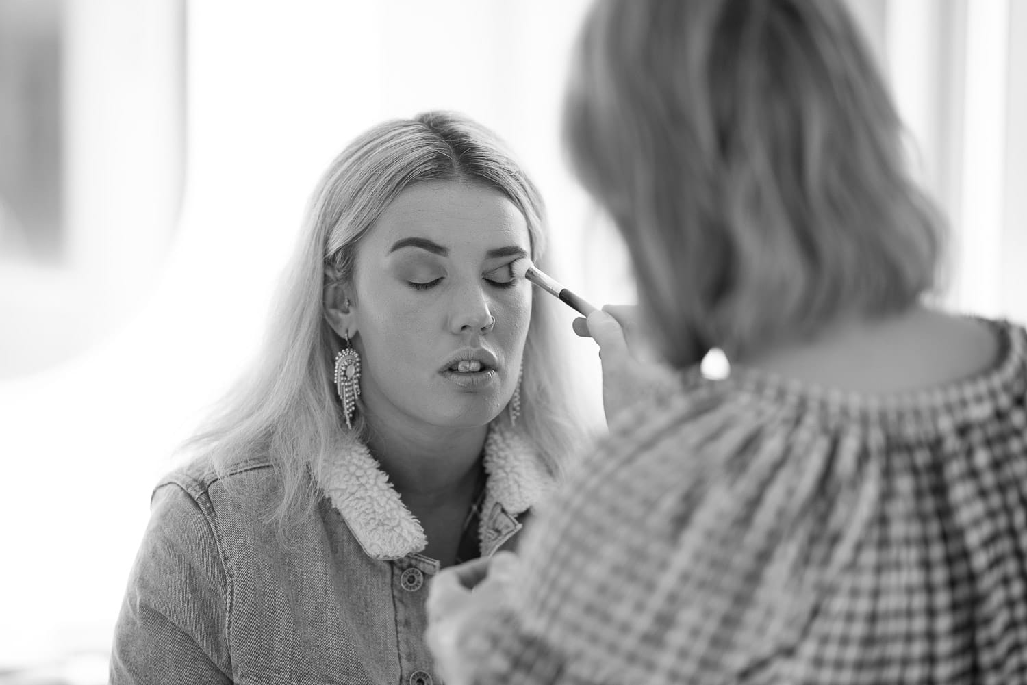 Bride getting makeup done in Colac at Queenie and Co.