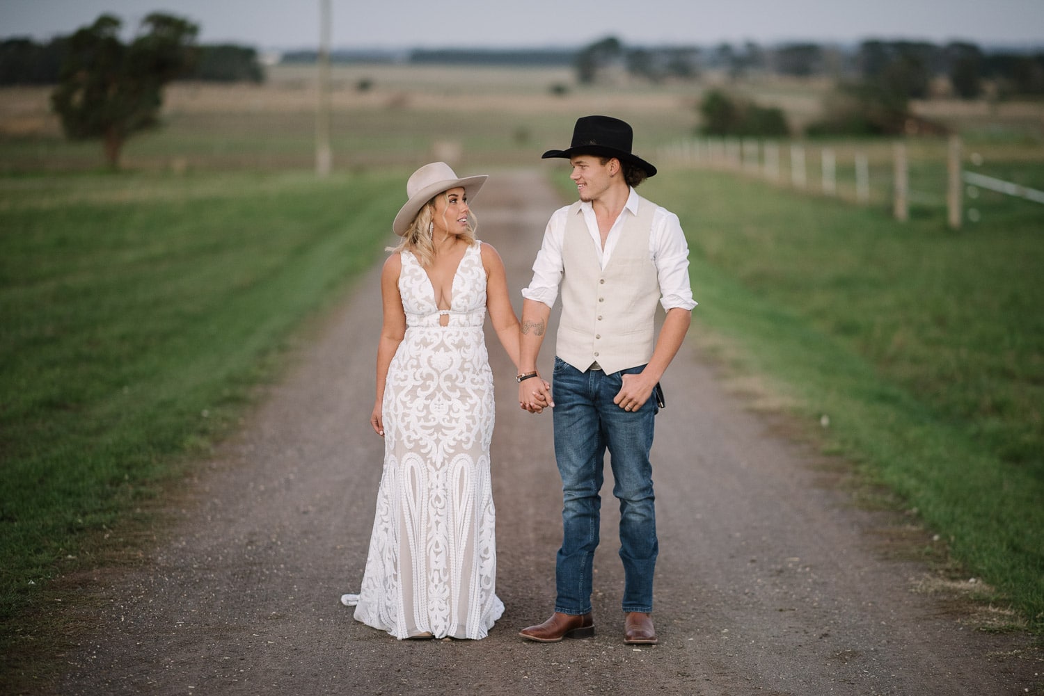 Couple stand in driveway at a Colac country wedding