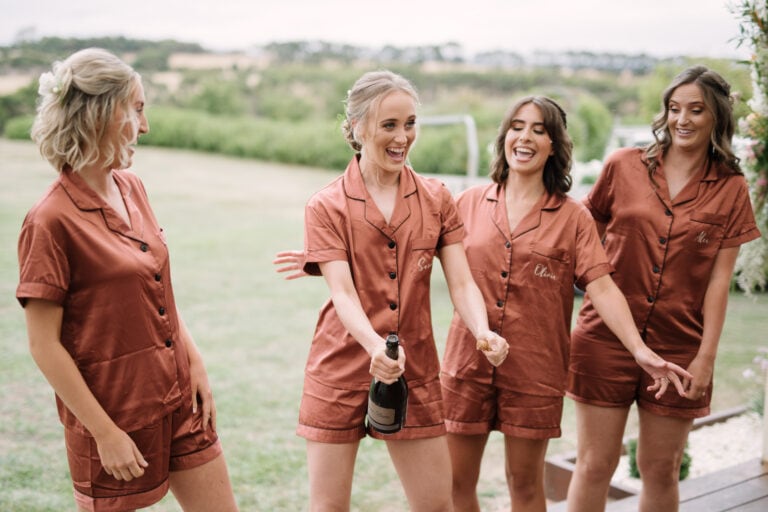 Bride popping champagne in Warrnambool