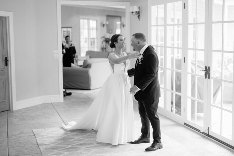 Bride hugging dad on her wedding day