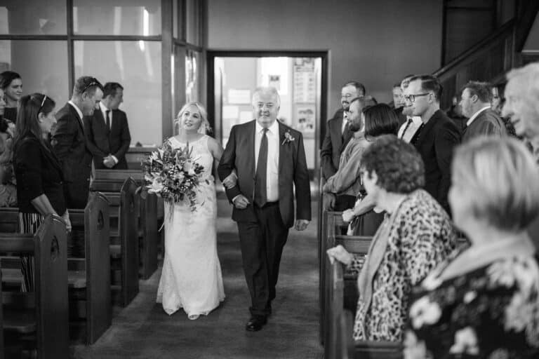 Bride walking down aisle with dad