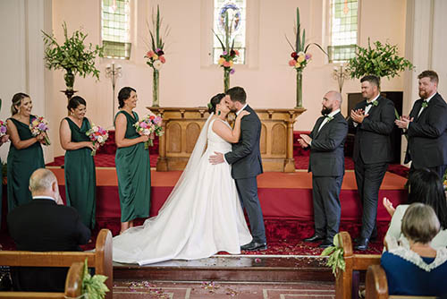 Bride and Groom kiss at St Brigid's Church in Warrnambool