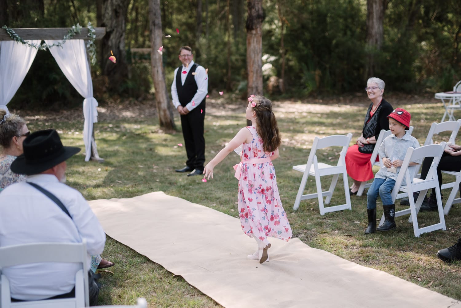 Flower girl throws flowers