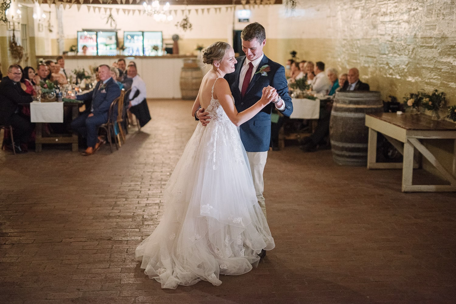 Couple dance at their wedding reception in the moloney room at Warrnambool Racecourse