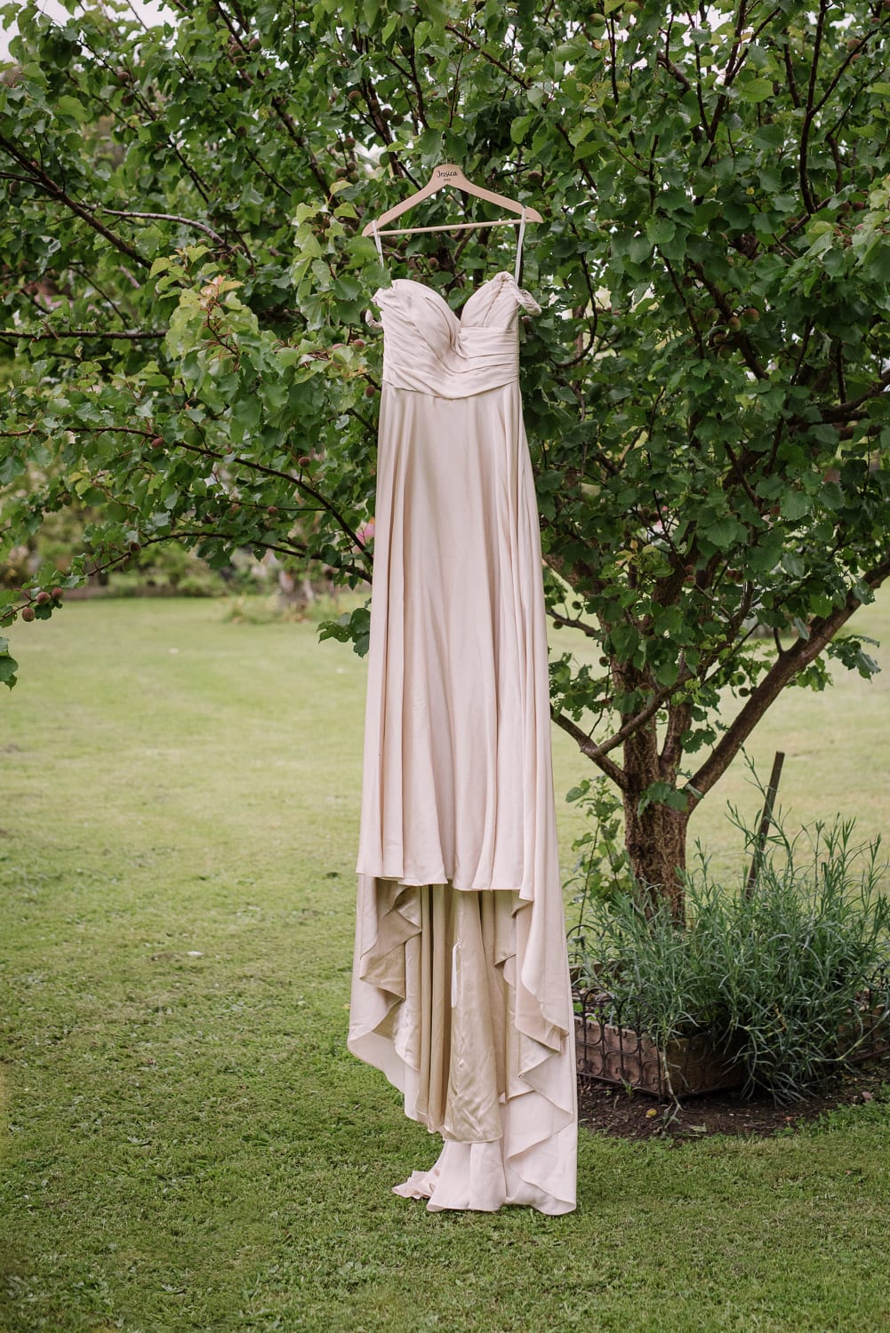 Wedding dress hanging in back garden