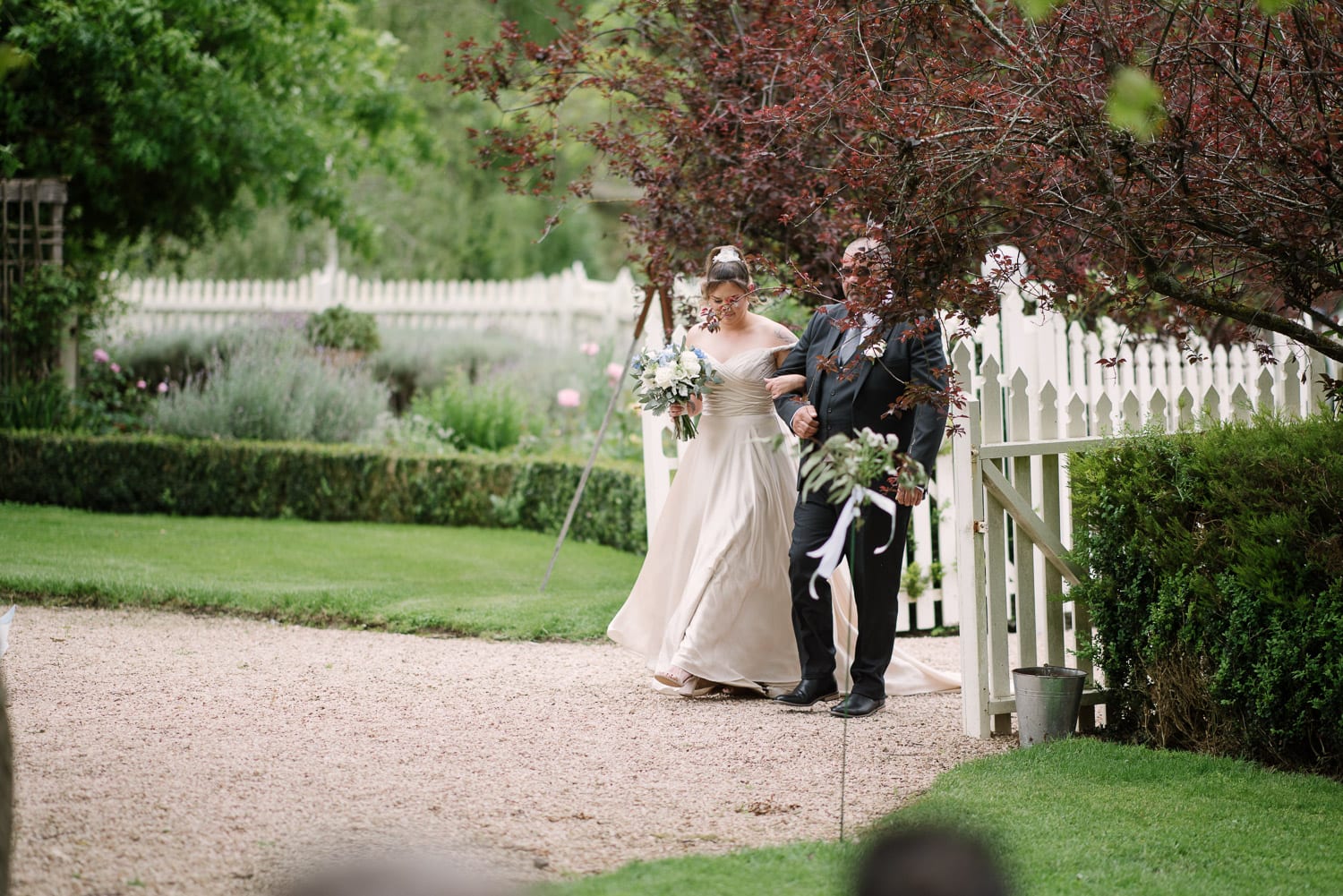 Bride walking down aisle at Quamby Homestead