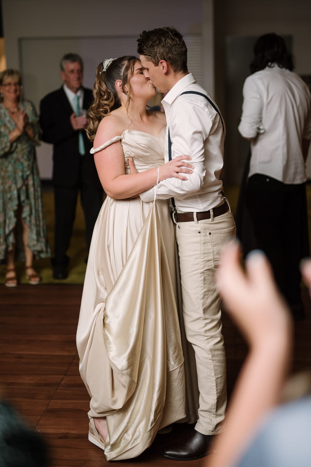 Final kiss at end of wedding reception.