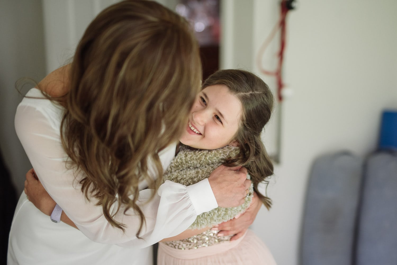 Bride hugging her daughter