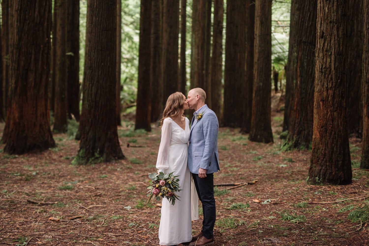 Bride and groom kiss in the Otways