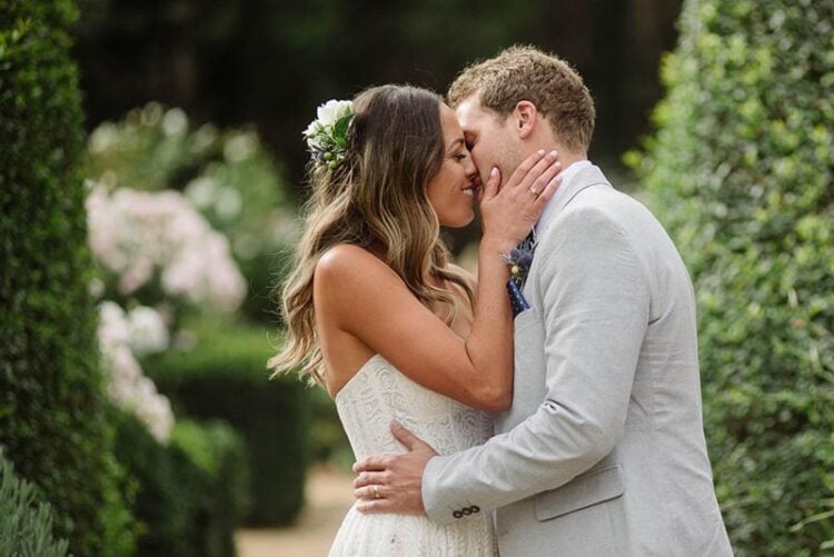 Bride and groom kissing as photographed by Warrnambool wedding PHhotographer Paul Benjamin