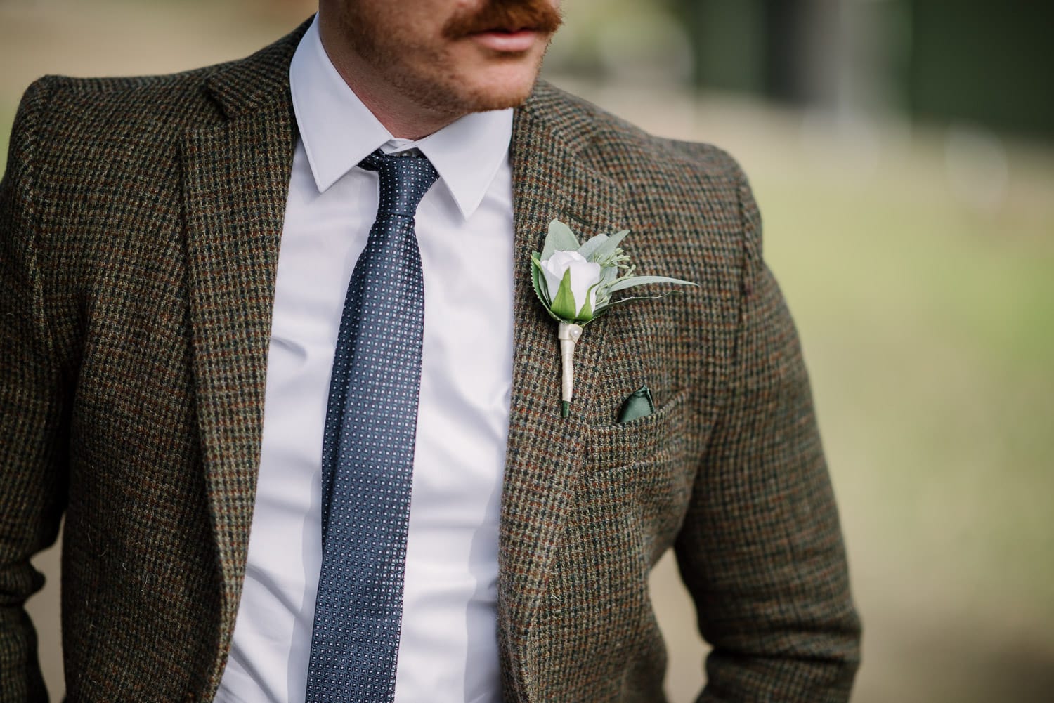 Groom wearing a tweed jacket