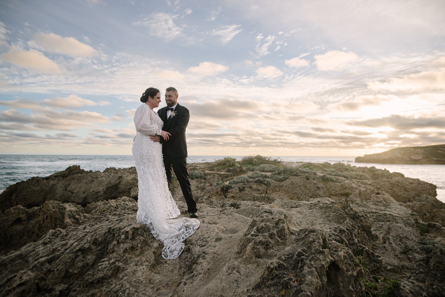 Wedding couple at Warrnambool breakwater at sunset